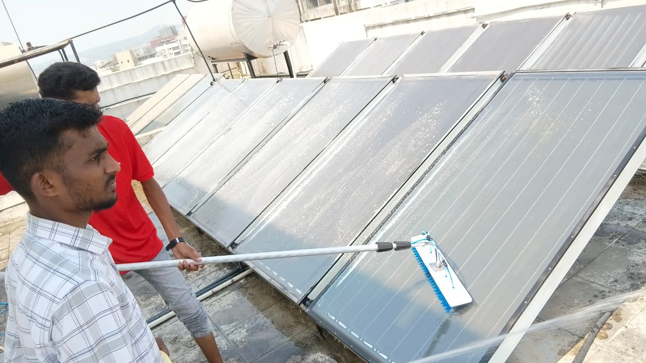 Scrubbing collector glass next to insulated hot water storage tank